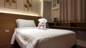 MySpace Hotel cozy standard room in Taguig with towel art and clean minimalist design.
