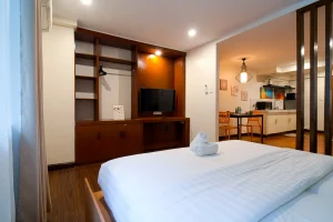 Studio suite at MySpace Windsor featuring modern interiors, soft lighting, and a comfortable bed.