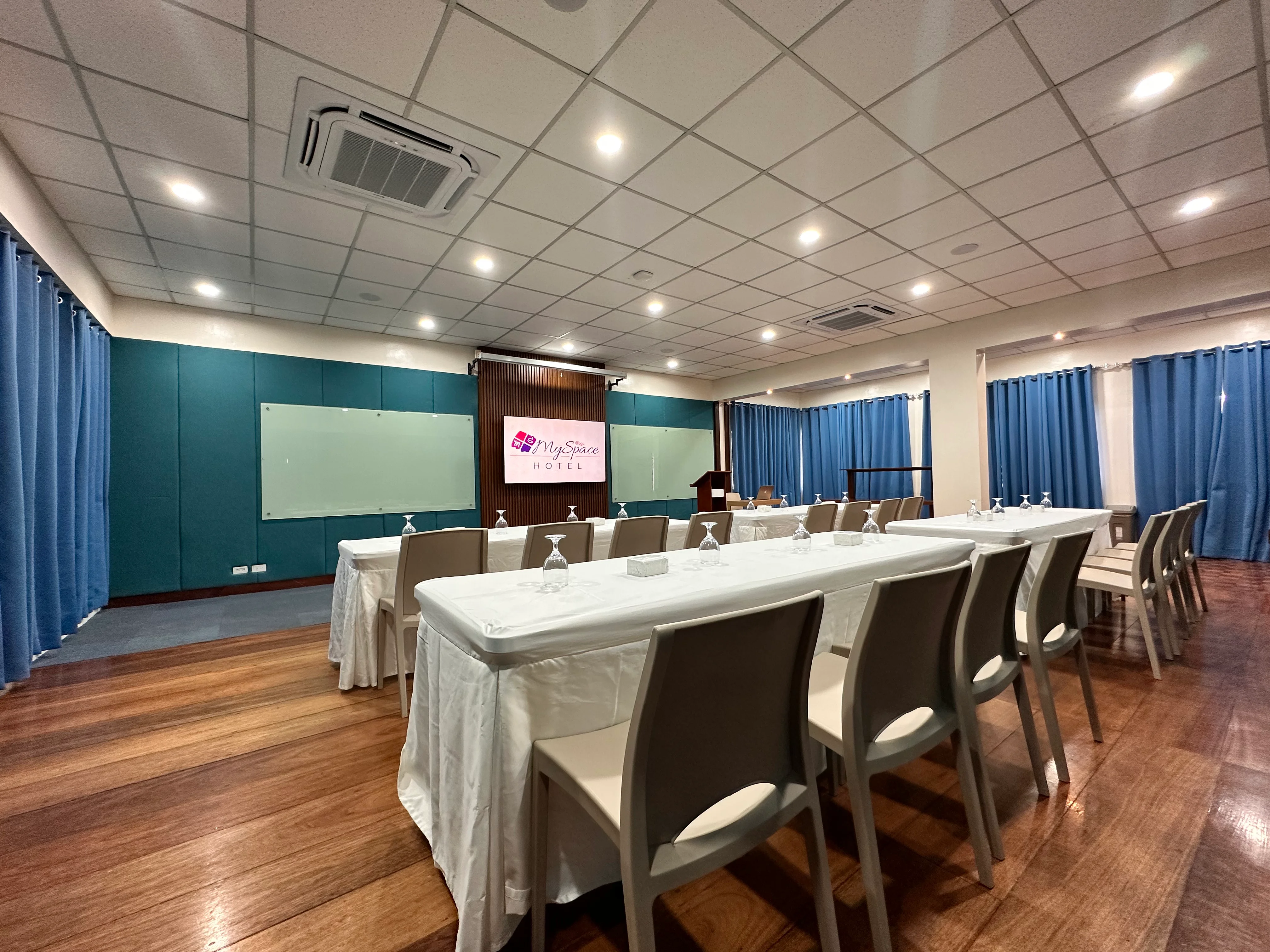 Function room in BGC with seminar seating and glass whiteboards at Hotel MySpace